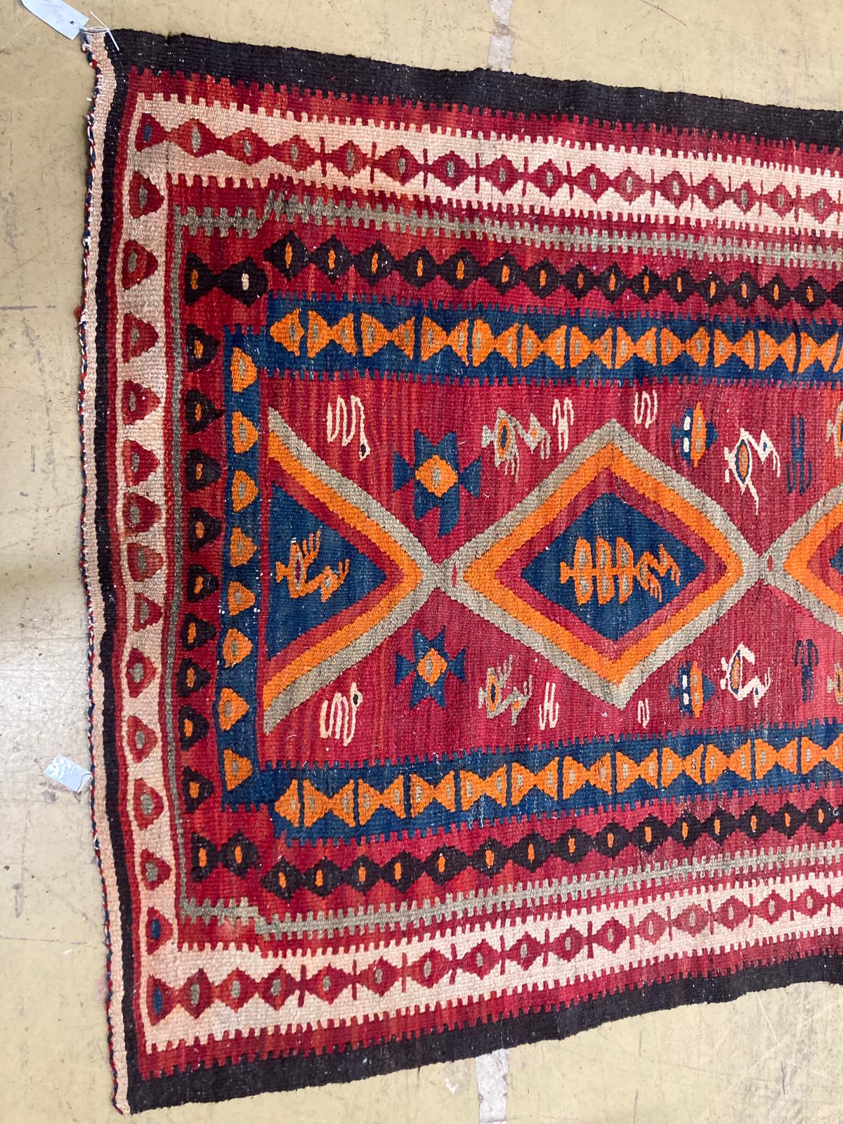 A polychrome Kelim rug, 270 x 134cm.